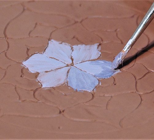 2 Begin painting color in the center, adding the second color before the first dries for a smooth blend.