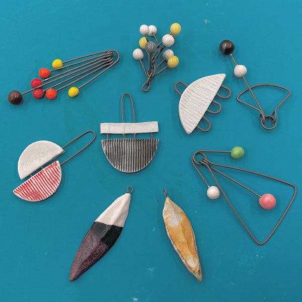 1 Form and decorate small clay elements and prepare them for metal parts.