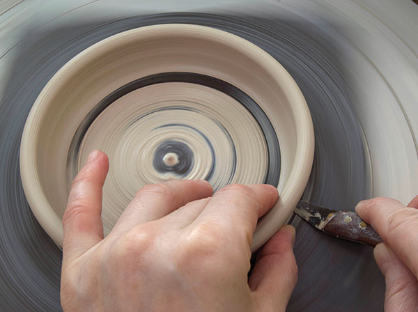 3 Throw a bottomless ring with short walls, then cut it off the wheel.