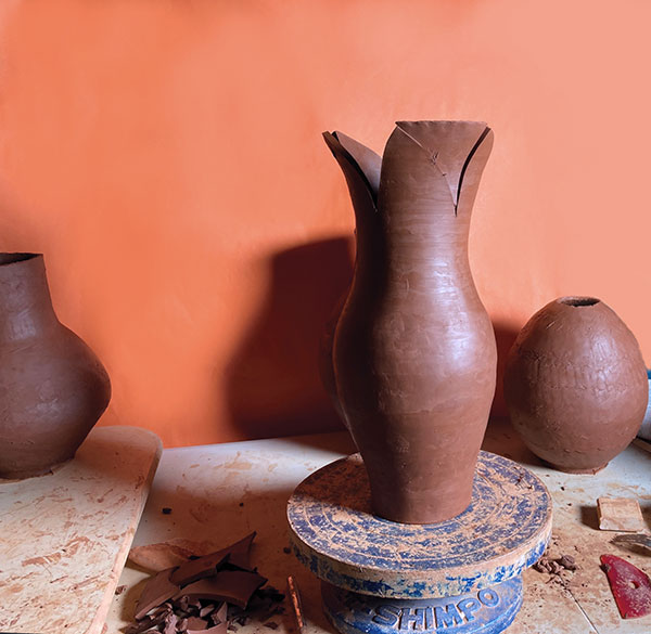 6 Cut petal shapes into the rim when the clay has firmed up to leather hard.