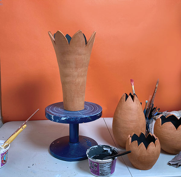8 Coat the interior with black underglaze, then apply a clear glaze over the top.