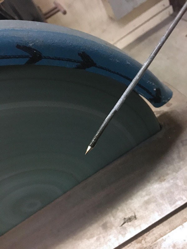 4 Sharpen the thermocouple tip with a bench grinder.