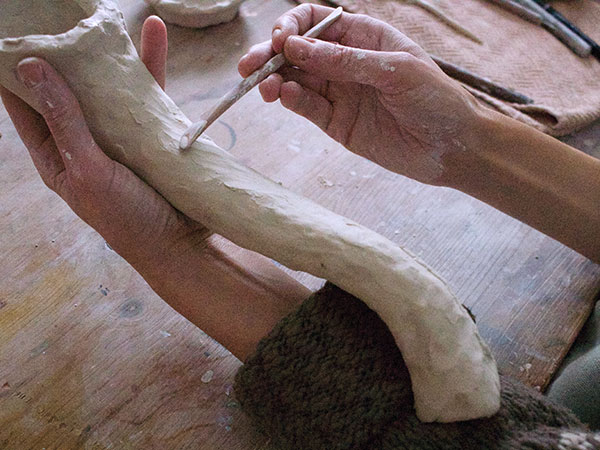 7 It’s helpful to use foam or support the spout over your arm as you join the long seams back together.