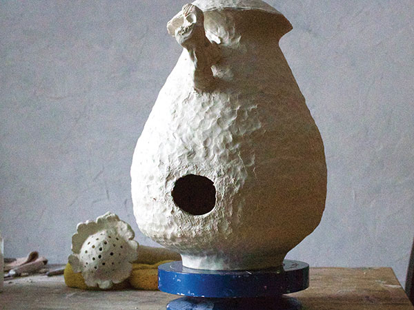 9 In preparing to join the spout to the body, cut a hole at the bottom and attach supports to hold up the top of the spout.