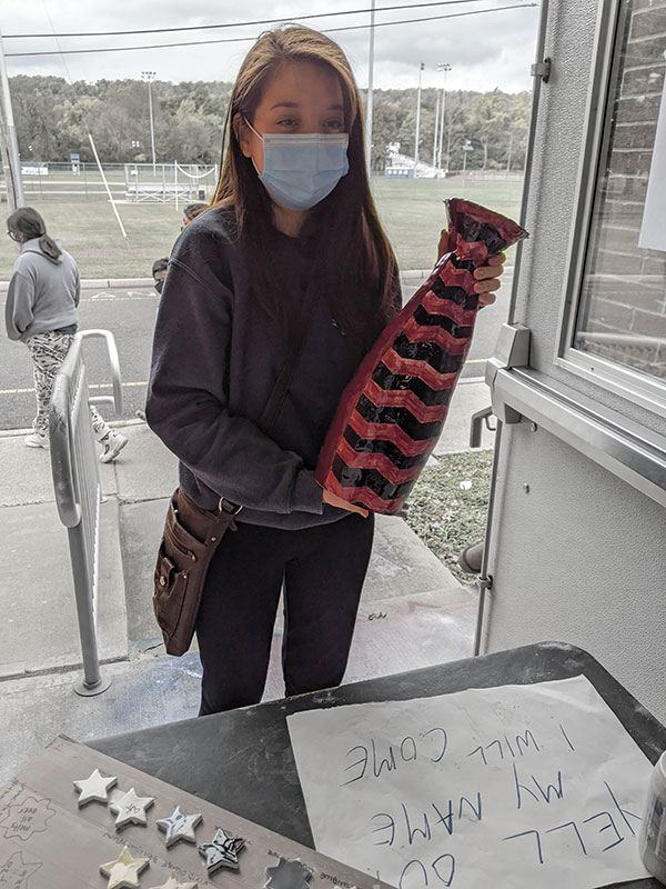 4 Grace Silva collecting her fired vase.