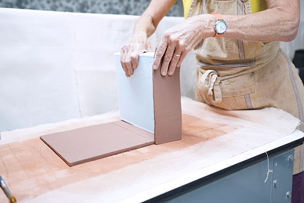 2 Score, moisten with magic water, and press the two sides into place.