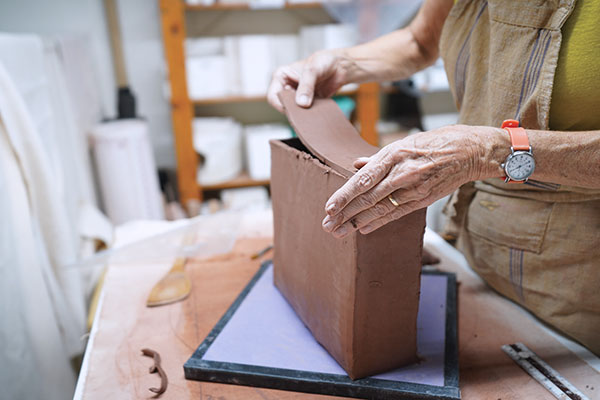 5 Score, slip, and attach the fourth slab on top of the box.