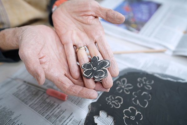 11 Once the flower shapes are thinned and at your desired diameter, soften the texture of each piece.