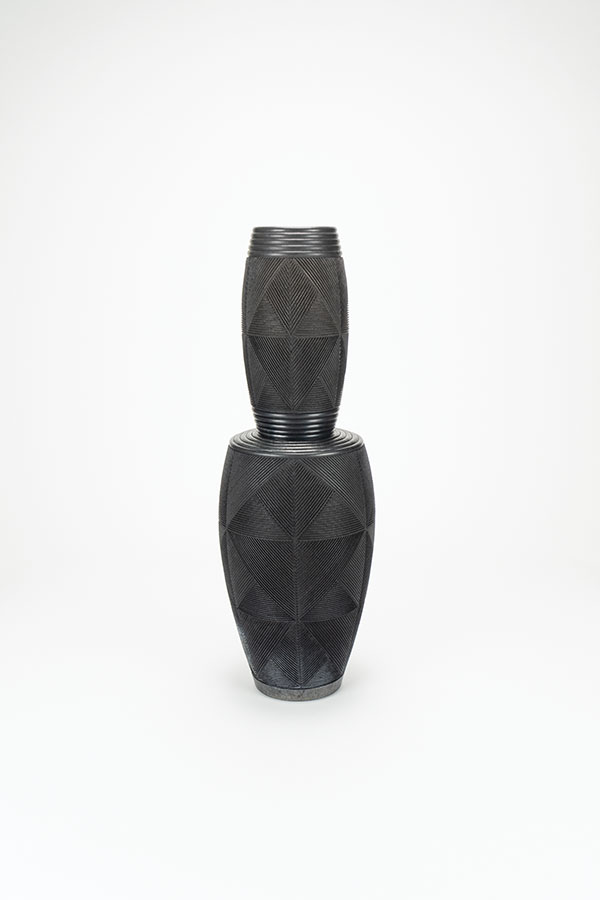 1 Andy Bissonnette’s two-tiered vase, wheel thrown and carved stoneware, terra sigillata, raku fired.