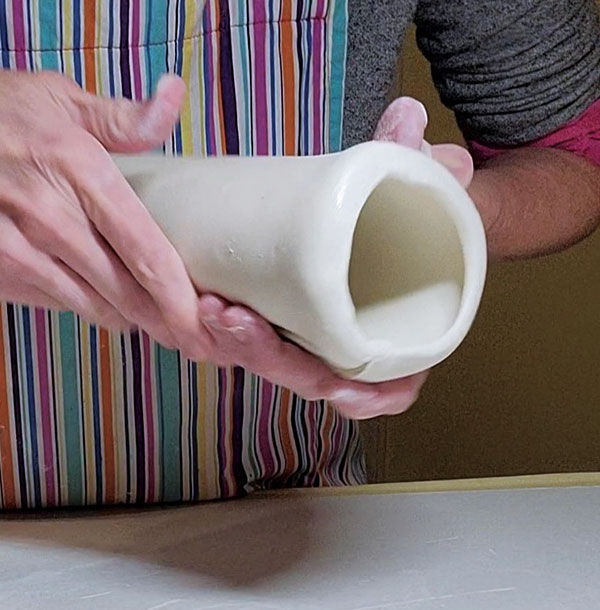 6 Roll the bottom edge of the pitcher body on a tabletop to form a rounded ledge.