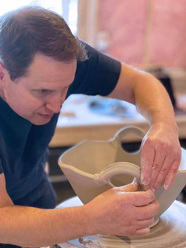 9 Slip and score the handle and bowl and attach the handle. Make sure to backfill any voids and clean up the slip around the attachment. This is a great time to do final refinements before trimming.