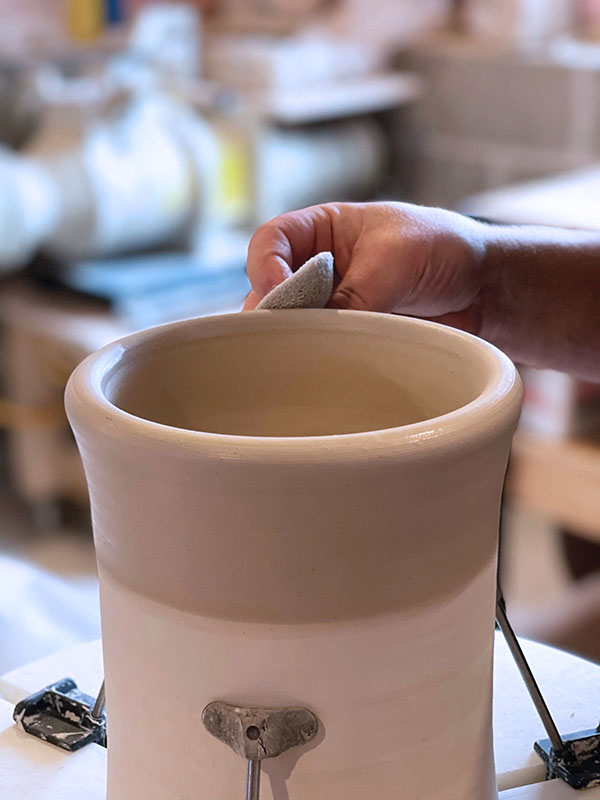 10 These serving bowls are trimmed on a chuck after the rims are altered and handles are attached. Either use a leather-hard chuck or dampen a bone-dry chuck so it sticks to the bowl while trimming to keep it in place.