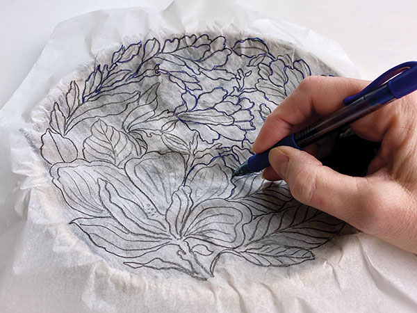 3 Transfer the design by impressing it onto the plate surface with a ballpoint pen, or sketch directly on the plate with pencil.