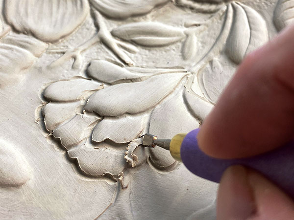 8 Carve contours and create undercuts to further refine imagery using a Kemper wire stylus and mini wire sculpting tools.