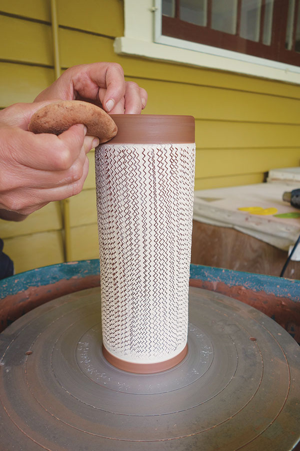 9 Use a lightly damp sponge to smooth out any cuts in the unslipped portions of the cylinder.