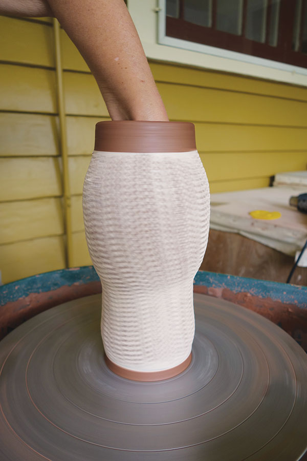 11 On the next stretch, continue to rib the cylinder from the inside, gradually moving downward and expanding the form.