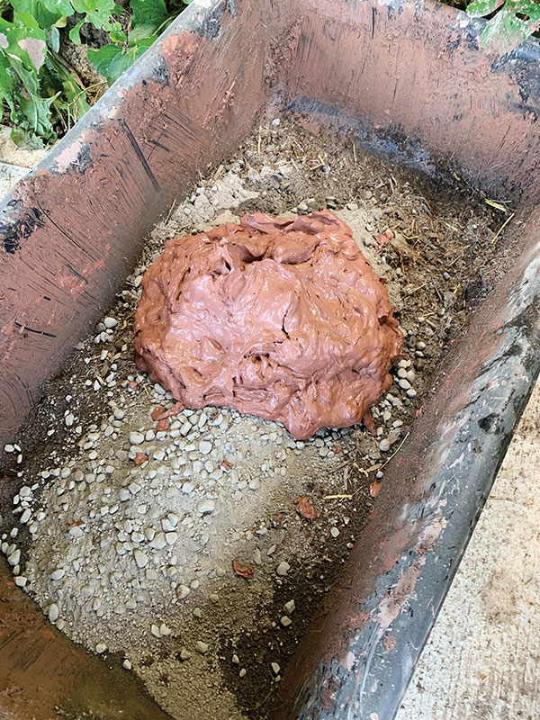 1. Mix mortar, sand, manure, clay slurry, and water to secure the cobblestones.