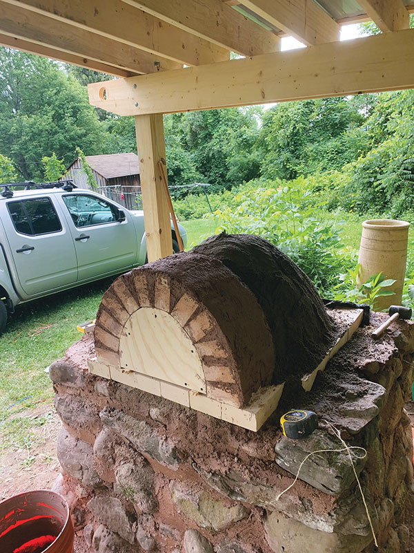 10. Trowel a mixture of clay slurry and mortar between bricks to hold them in place.
