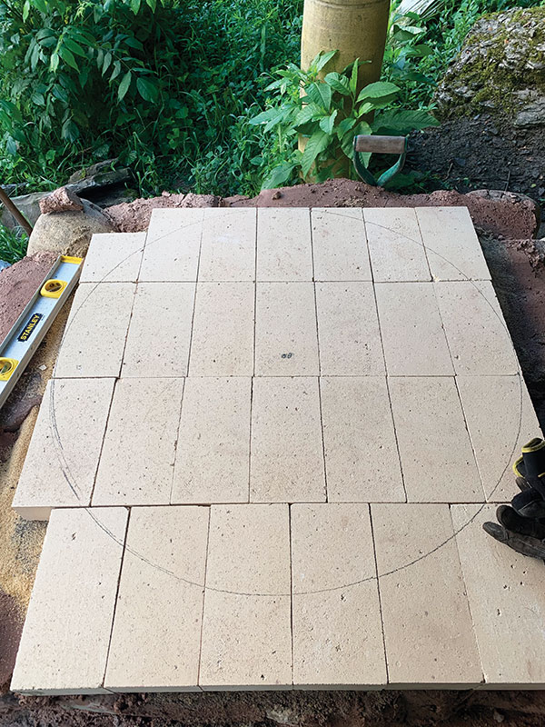7. With a string compass and pencil, draw the dome circumference on the bricks.