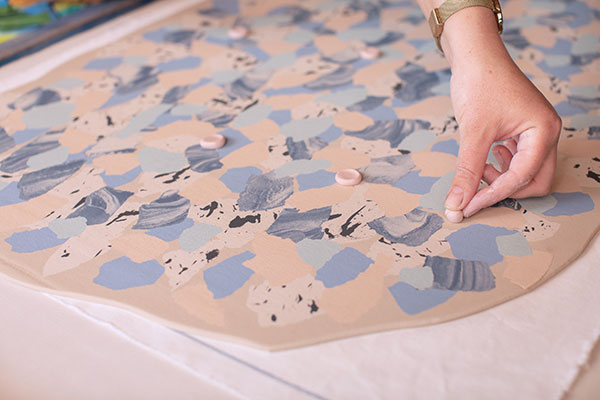 7 Push pink dots into the slab, roll, then push small black dot into pink dots.