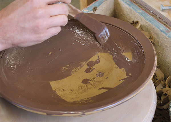 9 Paint all over the surface with a coating of thin to medium-thick black slip.