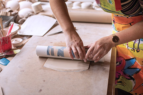 11 Line the edges up as you roll tightly and evenly. Pull the PVC pipe and tissue out.