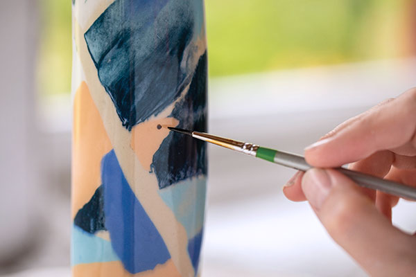 13 Apply gold luster dots to the exterior and rim using different brush sizes.