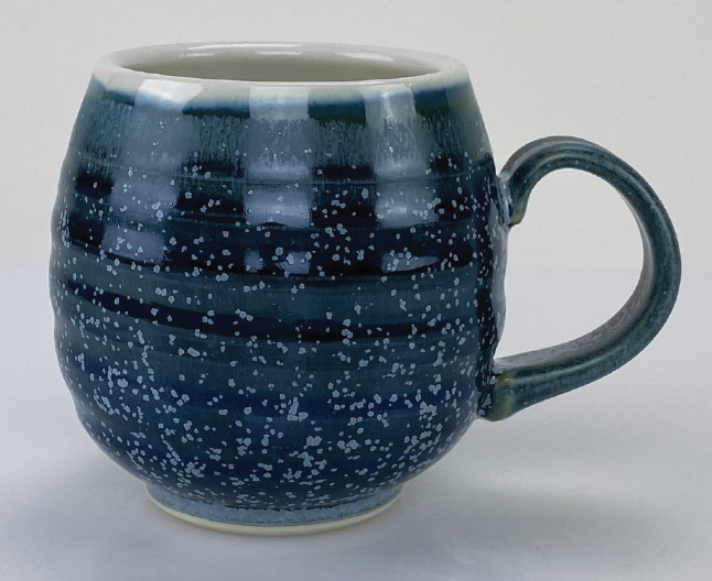 Wheel-thrown mug, exterior glazed with turquoise variant of base glaze, fired to cone 10.