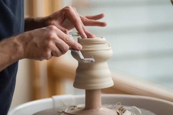 3 Place the cup onto the chuck and begin trimming by defining the outside diameter of the foot ring.