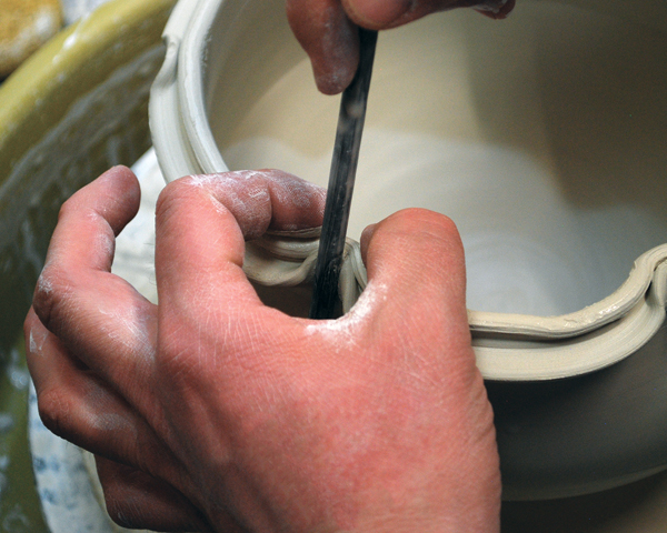 3 Pull the pinched area up and in with a dowel while supporting it with your other hand.