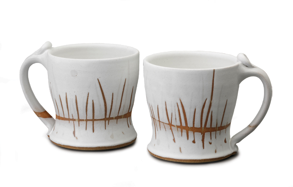 2 Tiffany Hilton’s mugs, wheel-thrown stoneware, wax resist, electric fired to cone 8, 2014. Photo: John Polak.