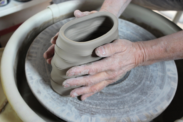 4 When you can touch the clay without leaving a mark and it’s still pliable, gently oval the form.