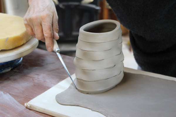 5 Place the oval form on a rolled slab, then trace the form and cut the shape out of the slab, leaving a little extra.