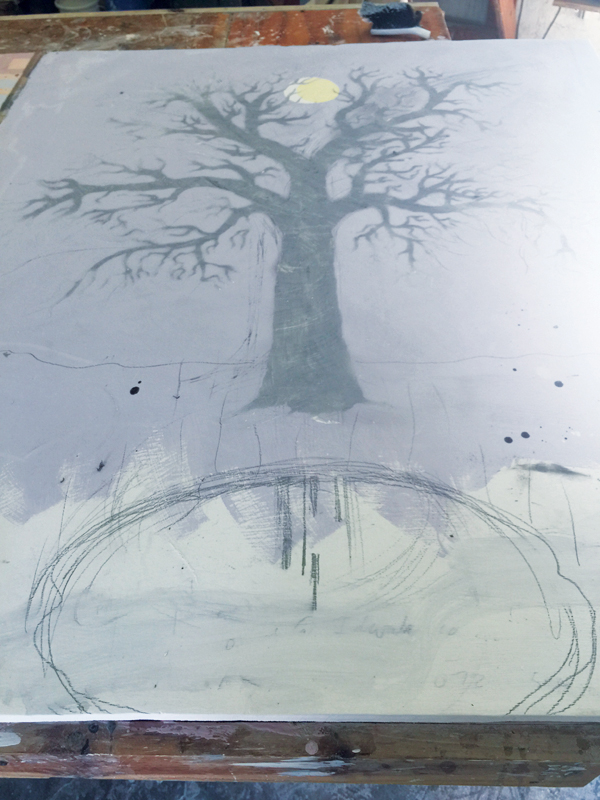 10 Light gray slip is rubbed through the stencil to define the tree further.