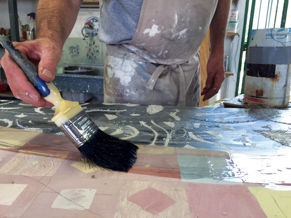 15 Wax is painted on over the entire tile. 