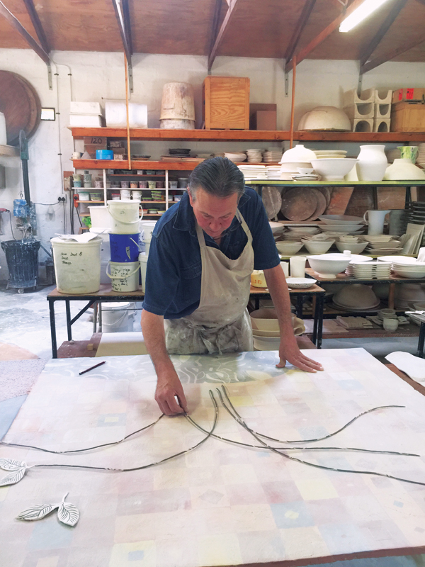  22 Branches made from fusion clay are rolled out, bisque fired, then added to the surface. 