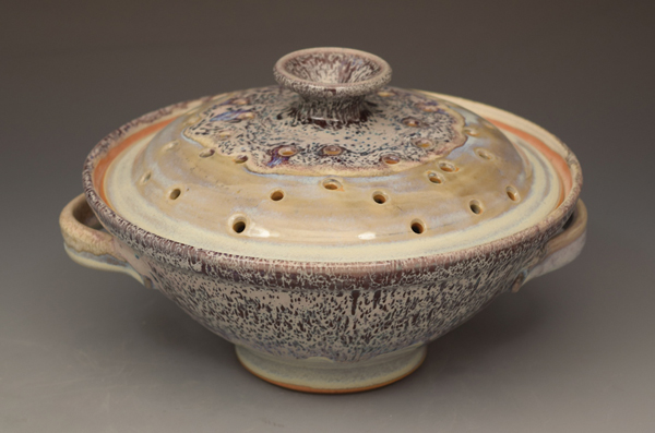 One of Sumi von Dassow’s wheel-thrown and multi-glazed popcorn poppers, fired to vitrification, making it suitable for microwave use.