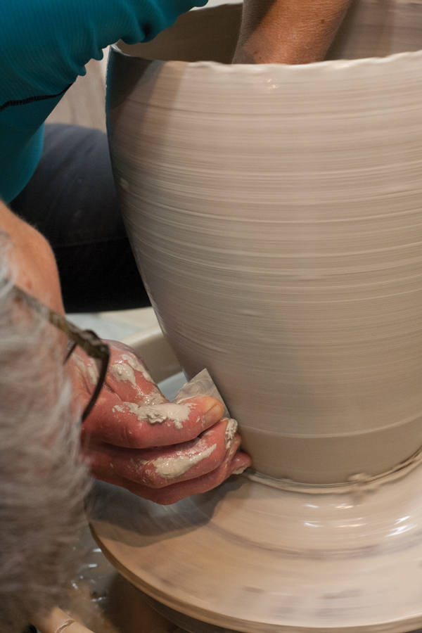 3 Use a metal rib to refine the form and remove the throwing lines.