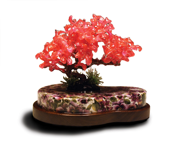 2 Rain Harris’ Bon Mot, 10 in. (25 cm) in height, porcelain, commercial decals, walnut, plastic tree, resin, 2016.