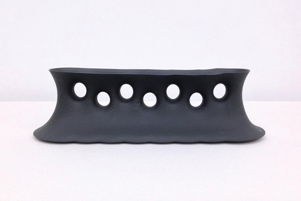 3 Andy Brayman’s Black Minimal Surface Vase, 29 in. (74 cm) in length, black porcelain, 2015.