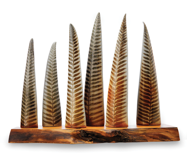 3 Sandra Carr, Joe Gelinas, and Cathi Jefferson’s 6 Ferns on Native Live Edge Arbutus Shelf, slab built, salt/soda fired to cone 10, arbutus shelf, 2012. Photo: John Sinal.