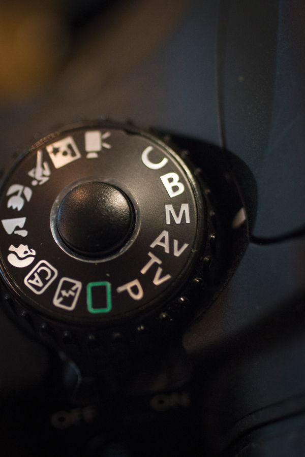6 Turn the selector to M (manual) to control aperture, shutter speed, and ISO.