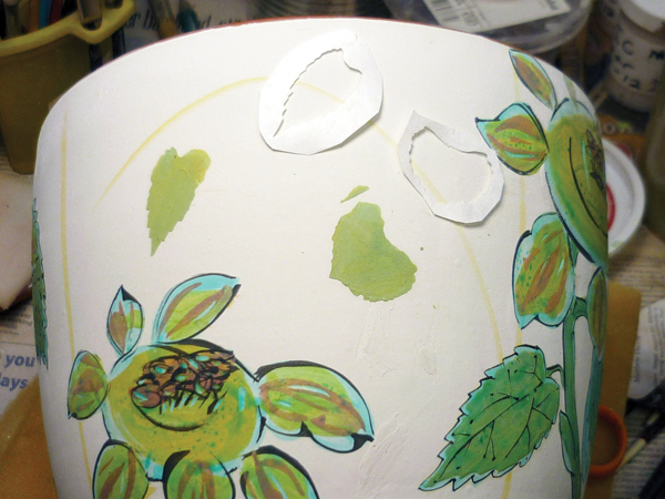5 Linda Arbuckle's majolica cup with Tyvek die-cut leaf stencils held on top of majolica glaze.