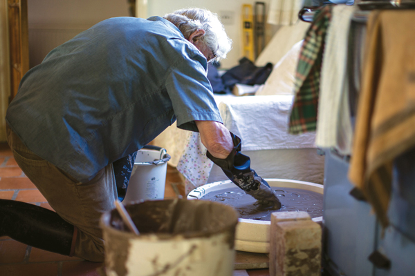 3 Frank Ashworth molding the basic shape of the Blue Plaques.
