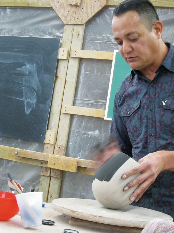 7 A black slip containing manganese dioxide is applied to the exterior.