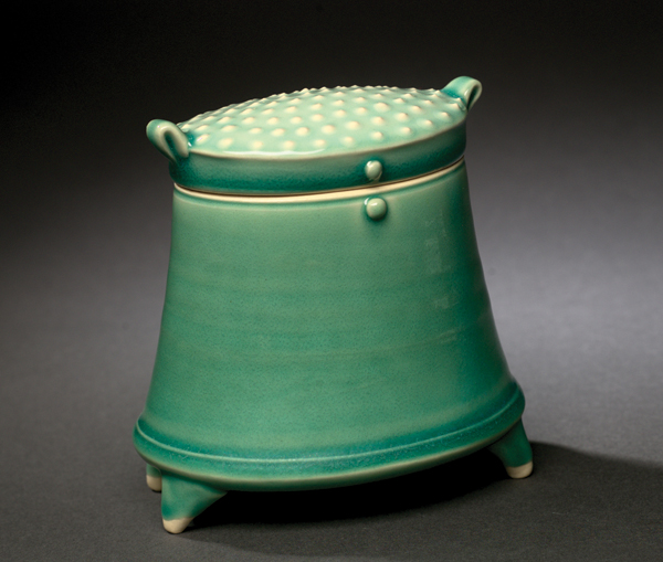 4 Green oval box, 6 in. (15 cm) in height, wheel thrown with handbuilt additions, slip decoration, glaze, electric fired to cone 6, 2012. Photo: Larry Pennington.