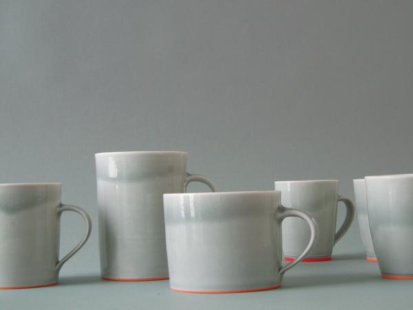 2 Mugs, wheel-thrown porcelain, slip, glaze, high fired, 2009.