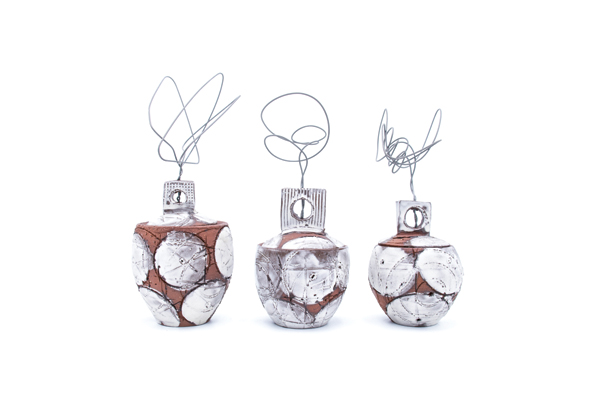 1 Three jars, 12 in. (30 cm) in height, wheel thrown porcelain, terra cotta, sandblasted glaze, nichrome wire, fired to cone 3 in an electric kiln, 2017. 