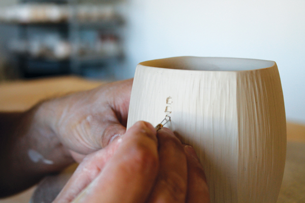 7 Incised details are added with a small flatheaded carving tool.