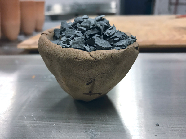 6 Sieve the feldspar chips to remove any smaller particles and dust.